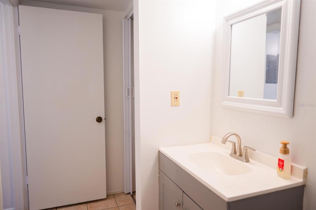 1902 Honour Road, Unit 23 Orlando, FL 32839 - Photo 24 of 31 a bathroom with a sink and a vanity