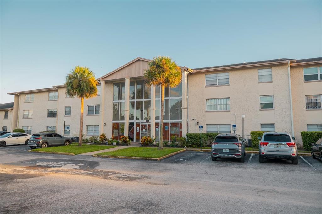 1902 Honour Road, Unit 23 Orlando, FL 32839 - Photo 27 of 31 a car parked in front of a white house