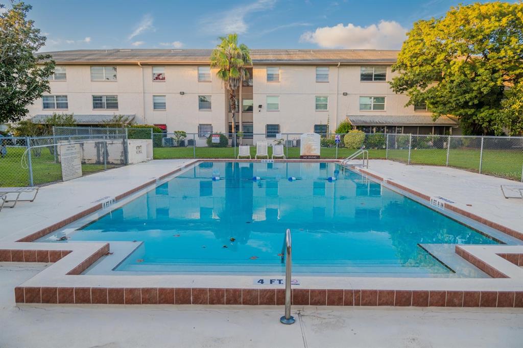 1902 Honour Road, Unit 23 Orlando, FL 32839 - Photo 30 of 31 a view of a swimming pool with a patio