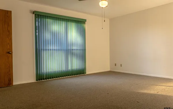 a bathroom with a toilet a sink and shower
