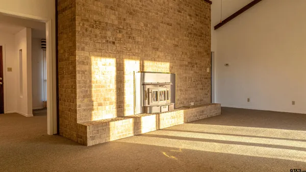 a spacious bathroom with a bathtub and next to a window