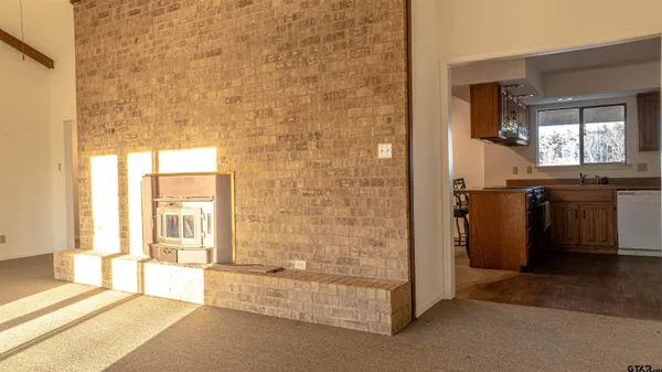 a spacious bathroom with a granite countertop tub sink and mirror