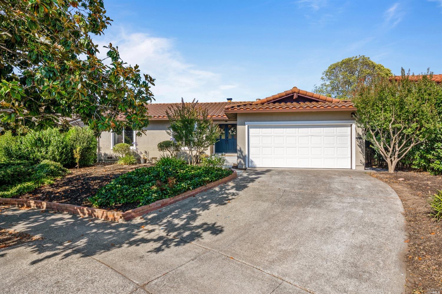 10 Greengate Court Santa Rosa, CA 95409 - Photo 1 of 1 a front view of a house with a yard and garage