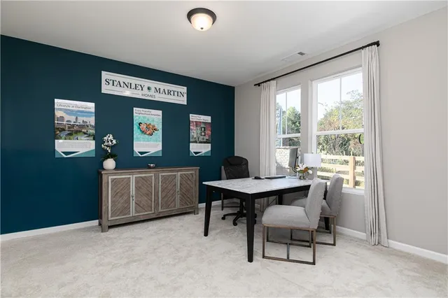 a workspace with furniture and window