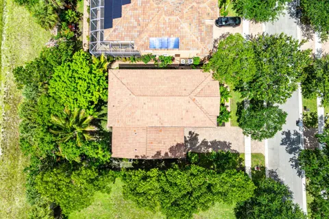 an aerial view of a house with a lake view