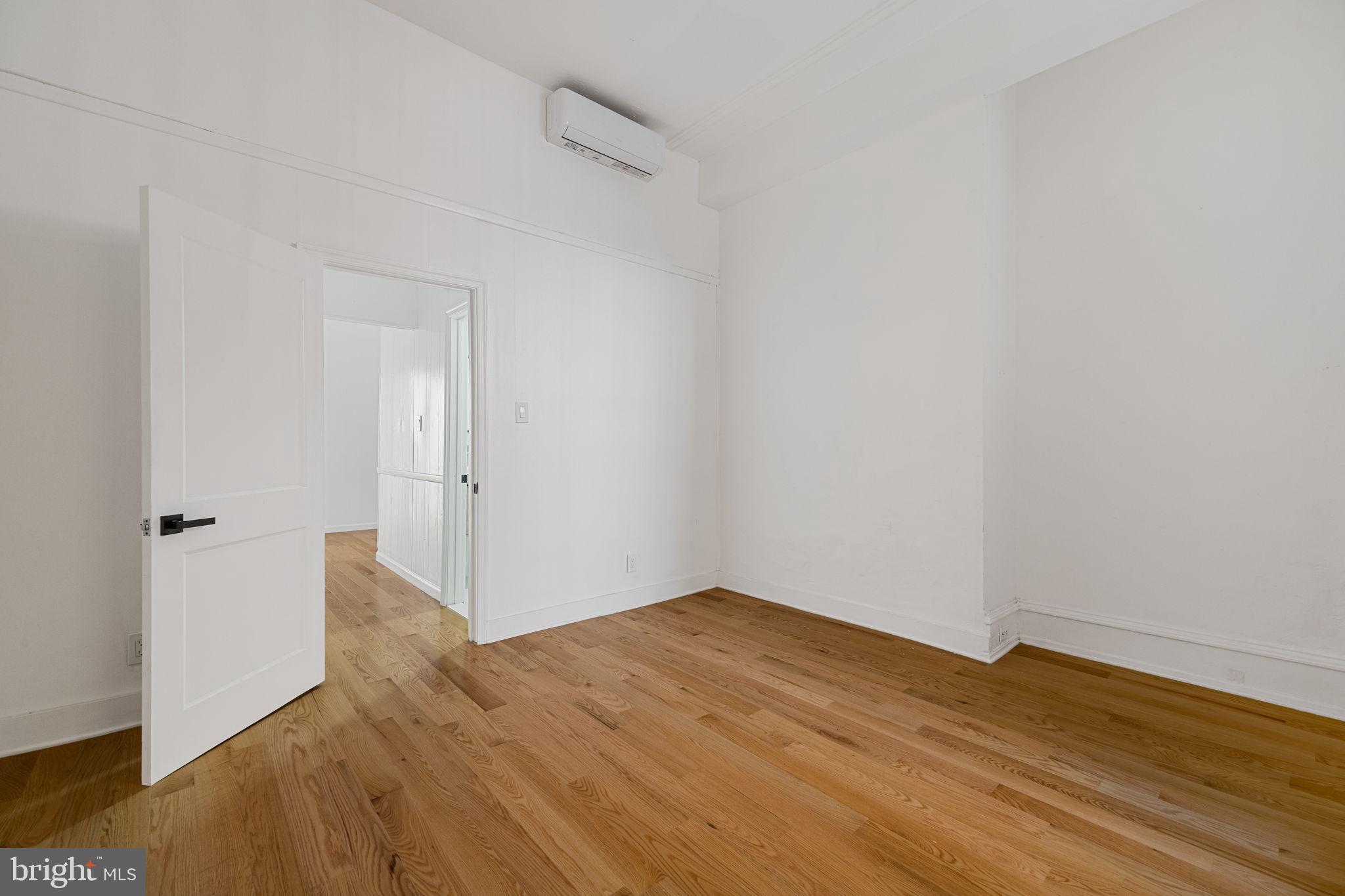 1225 Spruce Street, Unit 1F Philadelphia, PA 19107 - Photo 11 of 21 a view of an empty room with wooden floor