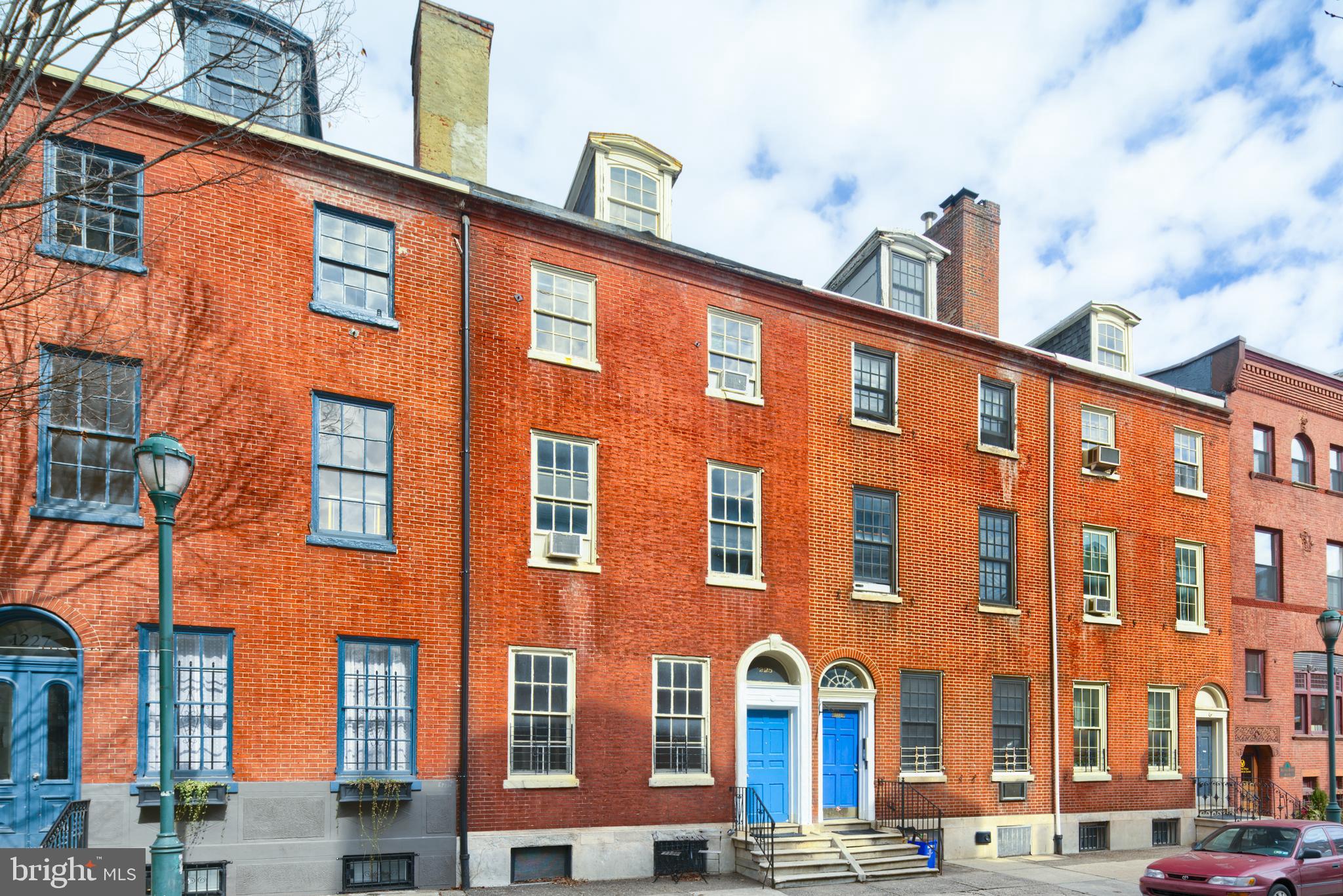 1225 Spruce Street, Unit 1F Philadelphia, PA 19107 - Photo 18 of 21 a front view of a building with lot of cars parked