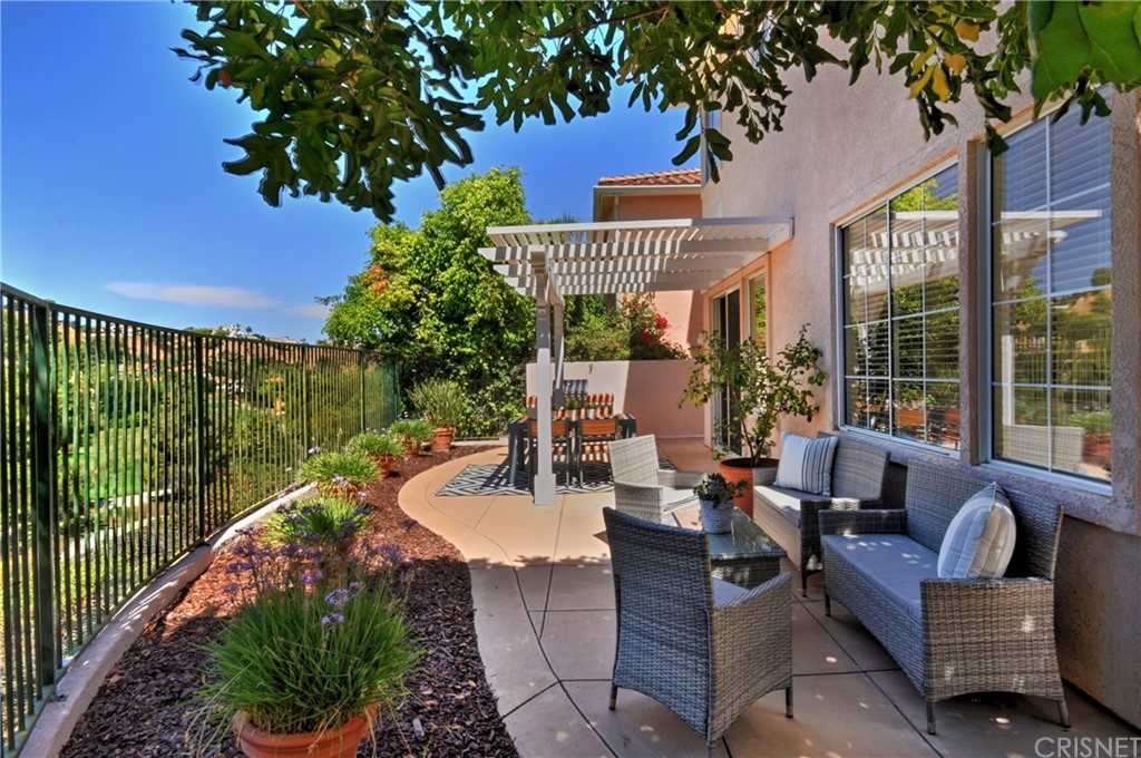 3619 Cll Joaquin Calabasas, CA 91302 - Photo 15 of 42 a view of a patio with couches table and chairs and potted plants