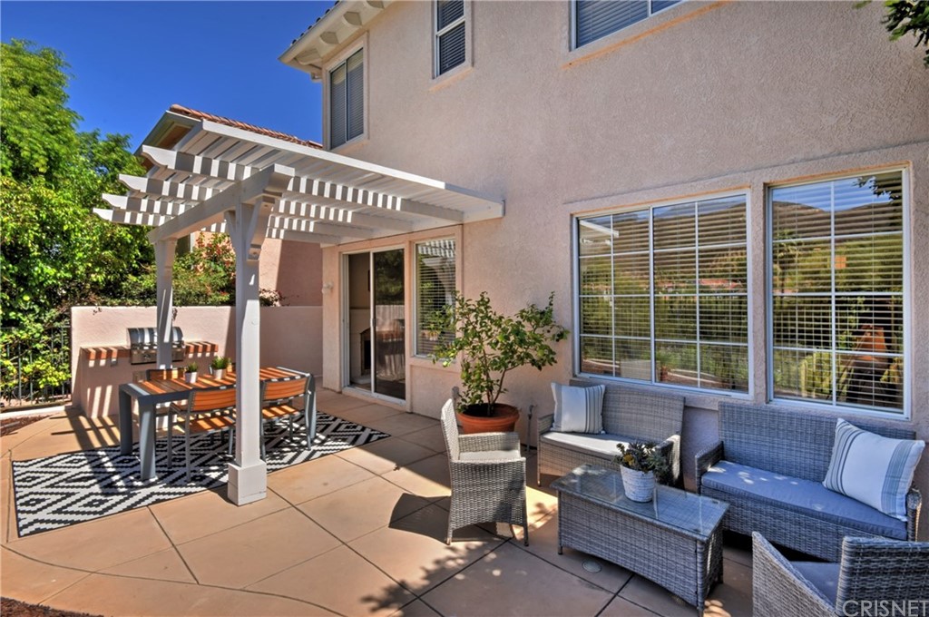 3619 Cll Joaquin Calabasas, CA 91302 - Photo 19 of 42 a view of a patio with couches table and chairs and potted plants