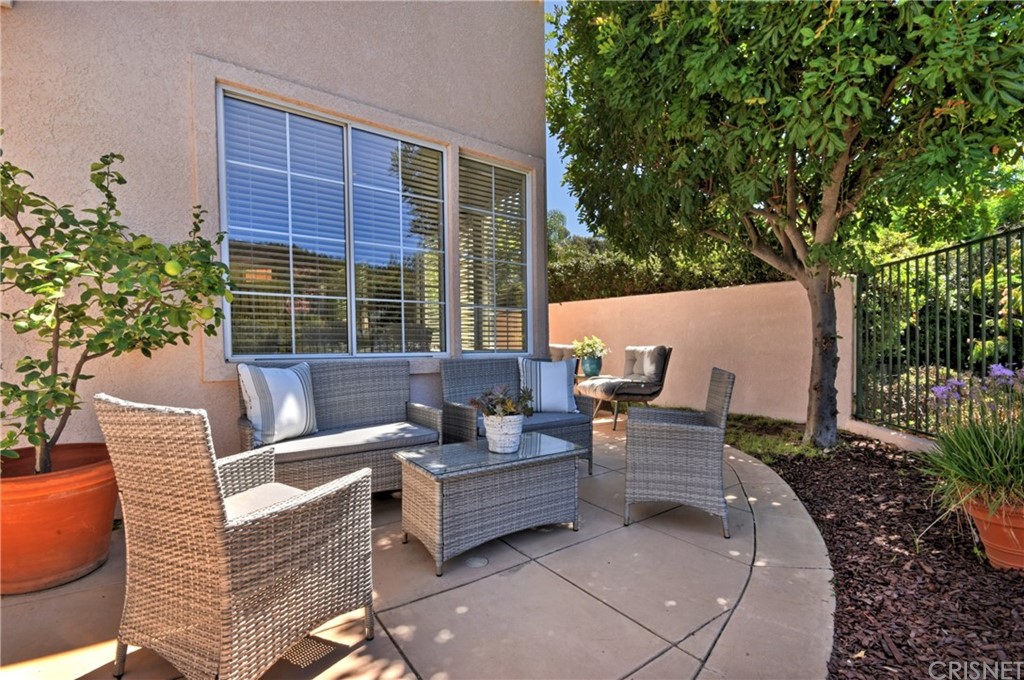 3619 Cll Joaquin Calabasas, CA 91302 - Photo 20 of 42 a view of a patio with couches chairs and a potted plant