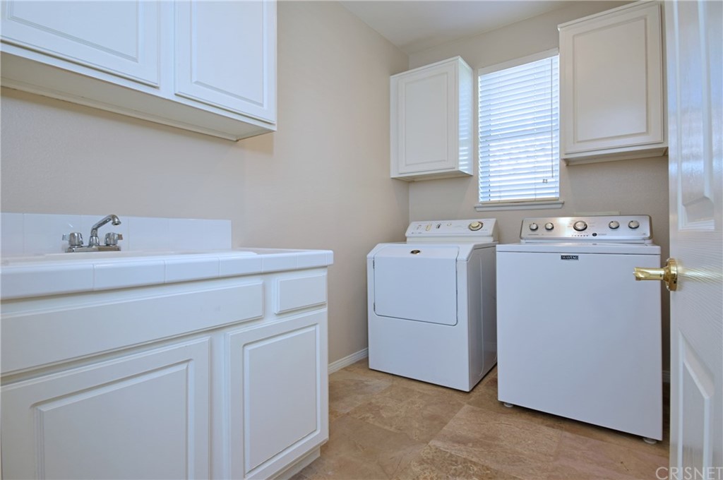3619 Cll Joaquin Calabasas, CA 91302 - Photo 32 of 42 a utility room with dryer and washer