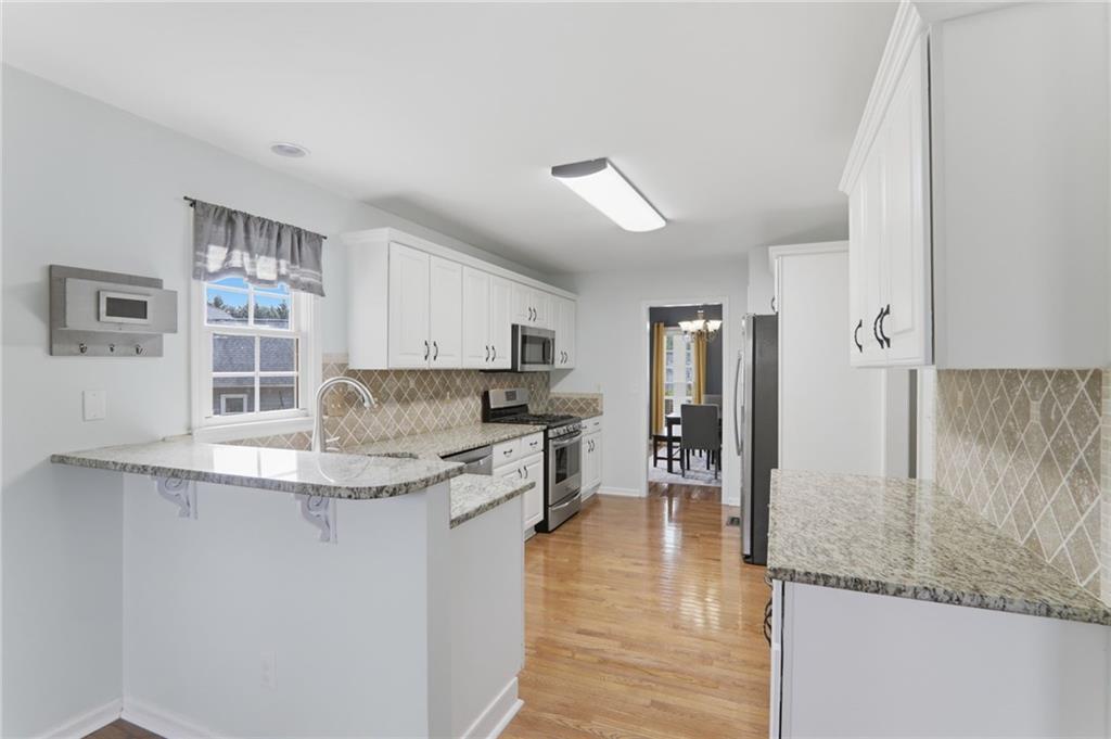 23 Crestview Terrace Dallas, GA 30157 - Photo 12 of 36 a kitchen with kitchen island a counter top space and cabinets
