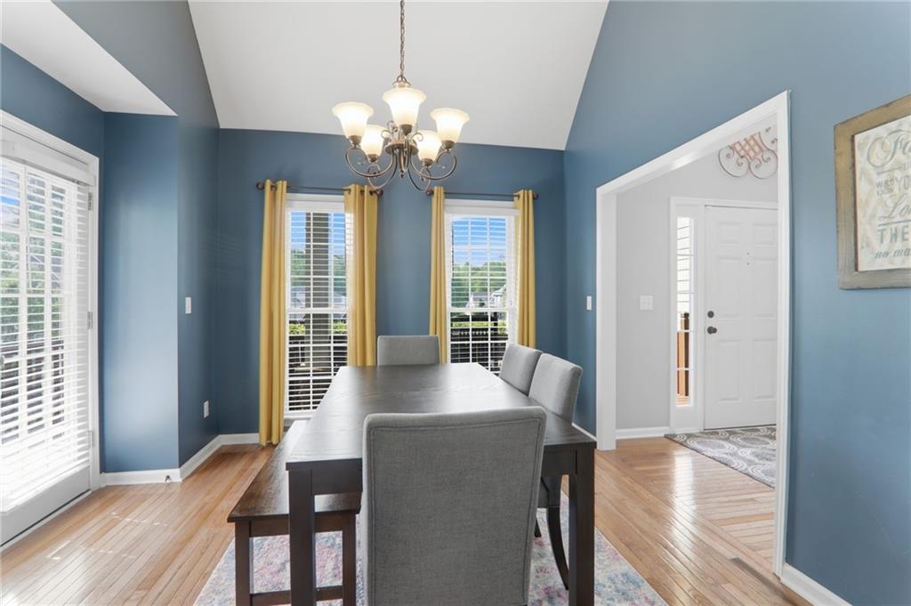 23 Crestview Terrace Dallas, GA 30157 - Photo 15 of 36 a view of a dining room with furniture wooden floor and chandelier