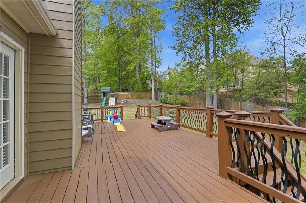 23 Crestview Terrace Dallas, GA 30157 - Photo 17 of 36 a view of a deck with wooden floor and fence next to a yard