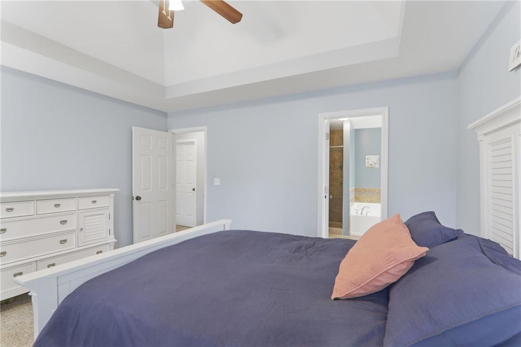23 Crestview Terrace Dallas, GA 30157 - Photo 20 of 36 a bedroom with a bed and a ceiling fan