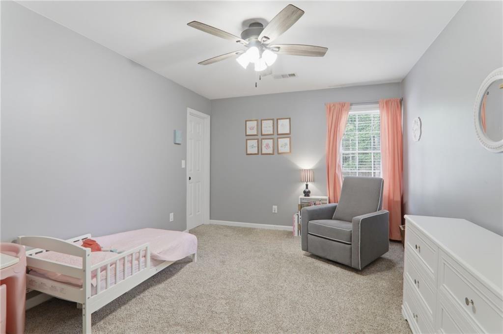 23 Crestview Terrace Dallas, GA 30157 - Photo 26 of 36 a bedroom with a bed couch and window