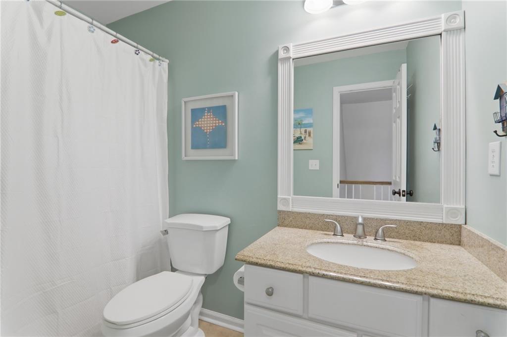 23 Crestview Terrace Dallas, GA 30157 - Photo 27 of 36 a bathroom with a granite countertop toilet sink and mirror