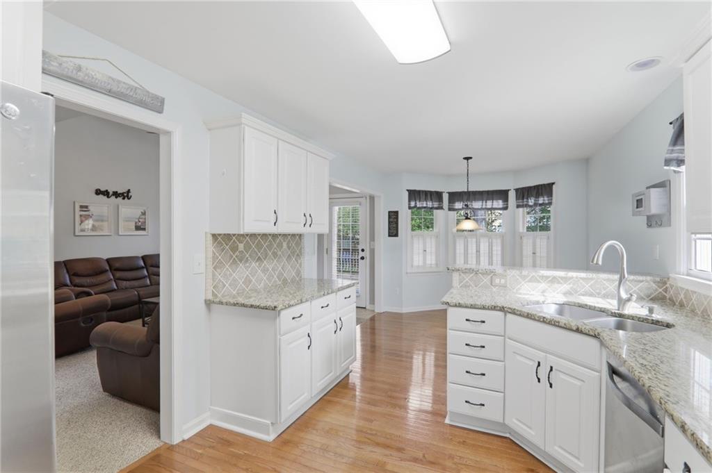 23 Crestview Terrace Dallas, GA 30157 - Photo 10 of 36 a kitchen with granite countertop a sink and cabinets