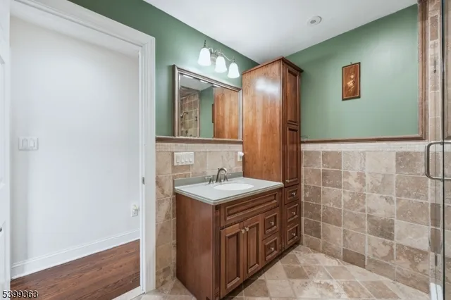 a bathroom with a sink a vanity and a mirror