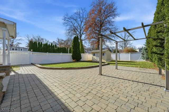 a view of a park with large trees