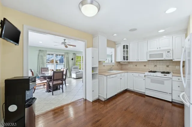a kitchen with sink and cabinets