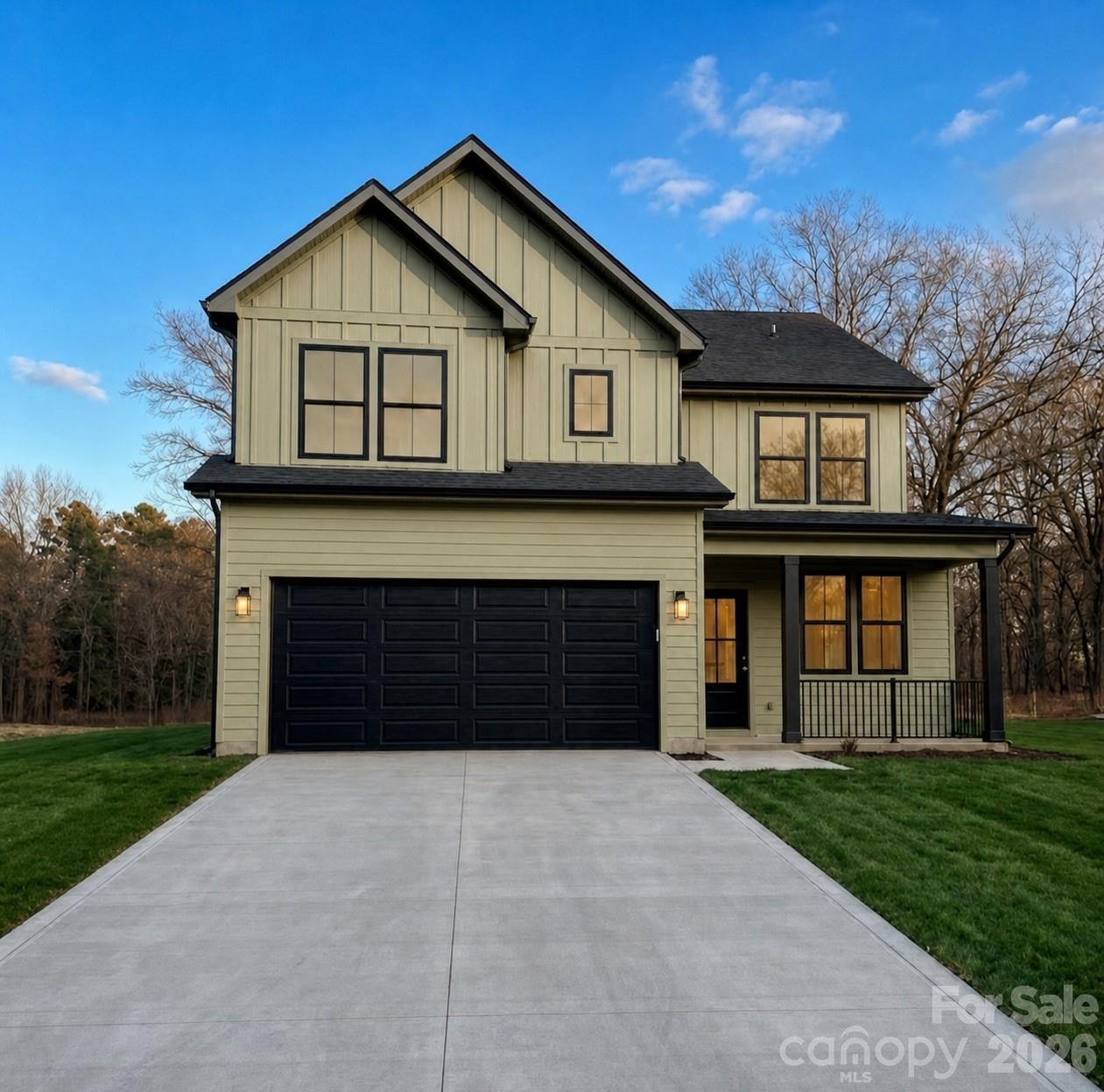 9050 Unity Church Road Mooresville, NC 28115 - Photo 1 of 32 a front view of a house with a garden