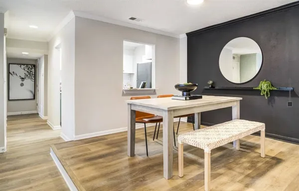 a kitchen with a table and chairs in it
