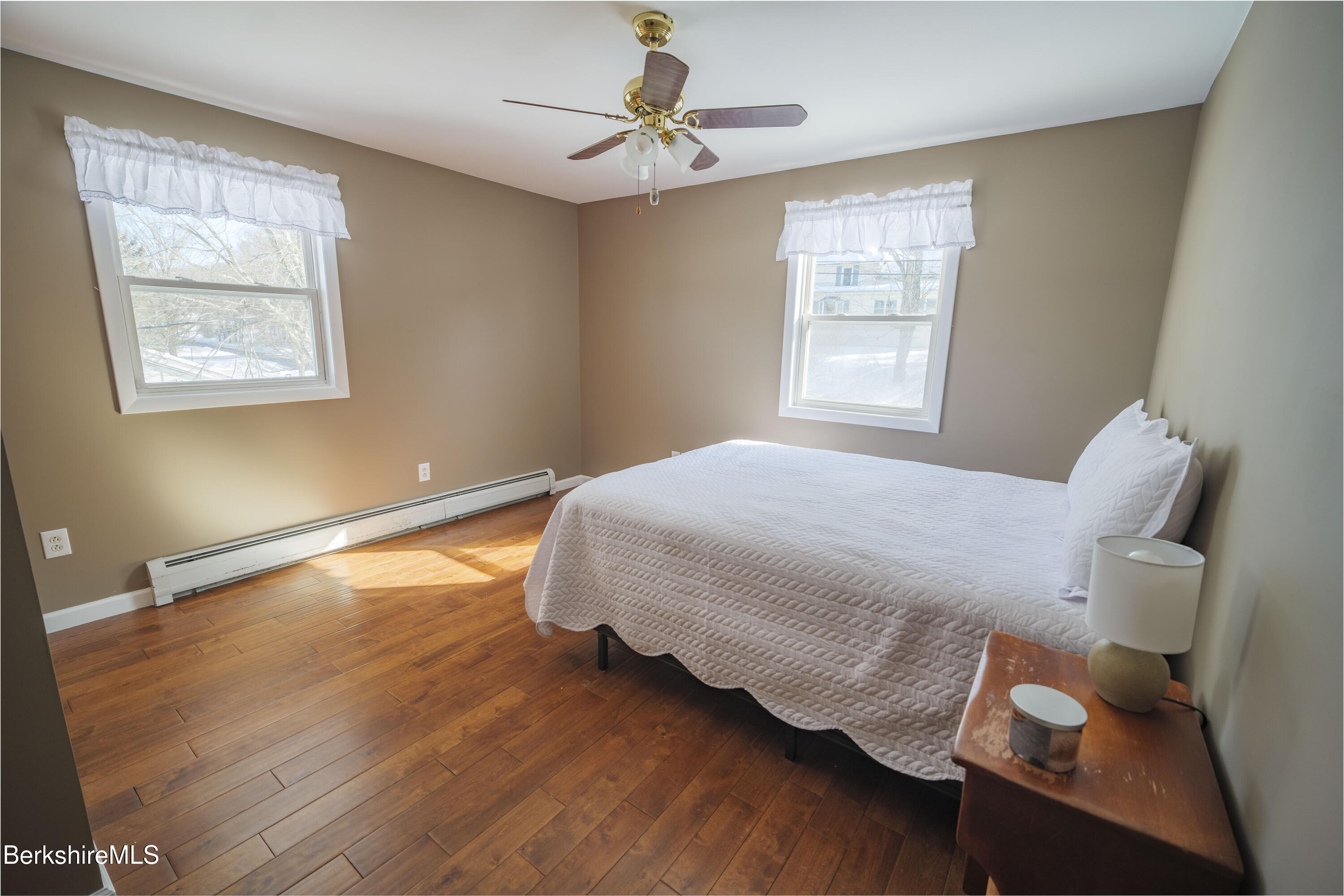 582 East New Lenox Road Pittsfield, MA 01201 - Photo 15 of 23 a bedroom with a bed and wooden floor