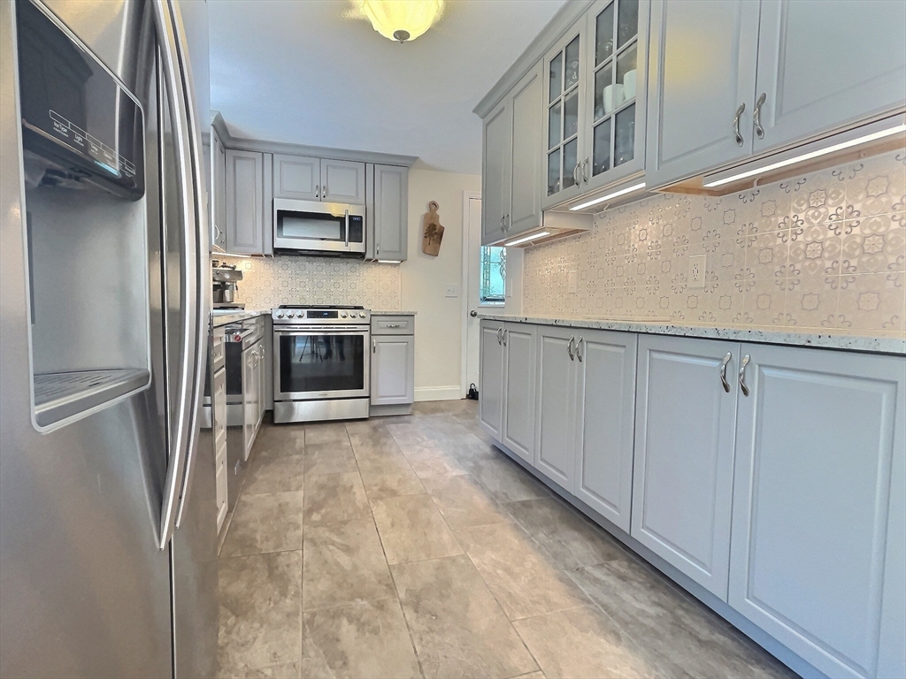 30 Edward Road Townsend, MA 01469 - Photo 1 of 42 a kitchen with stainless steel appliances granite countertop a refrigerator a stove and a sink