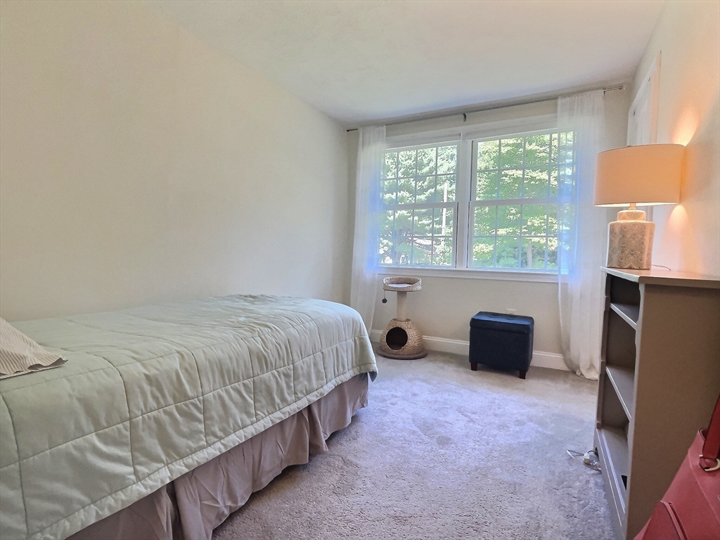 30 Edward Road Townsend, MA 01469 - Photo 11 of 42 a bed sitting in a room next to a window