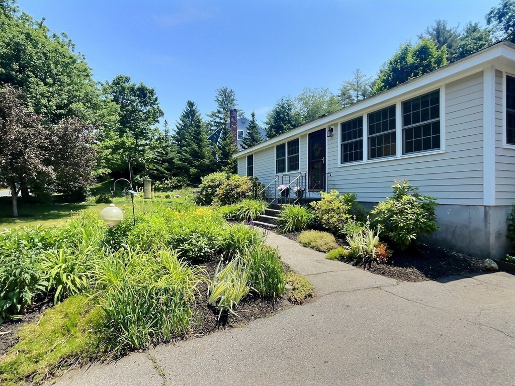30 Edward Road Townsend, MA 01469 - Photo 26 of 42 a front view of a house with a yard