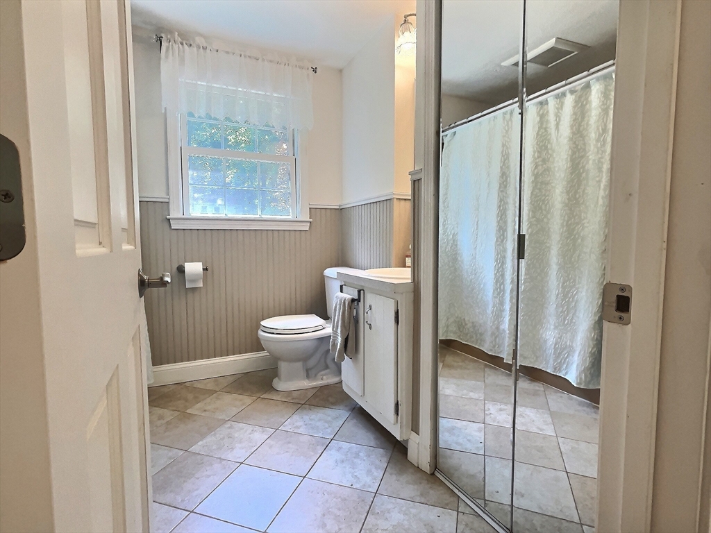 30 Edward Road Townsend, MA 01469 - Photo 7 of 42 a bathroom with a toilet a sink and a mirror