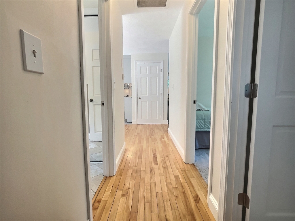 30 Edward Road Townsend, MA 01469 - Photo 10 of 42 a view of a hallway with wooden floor and staircase