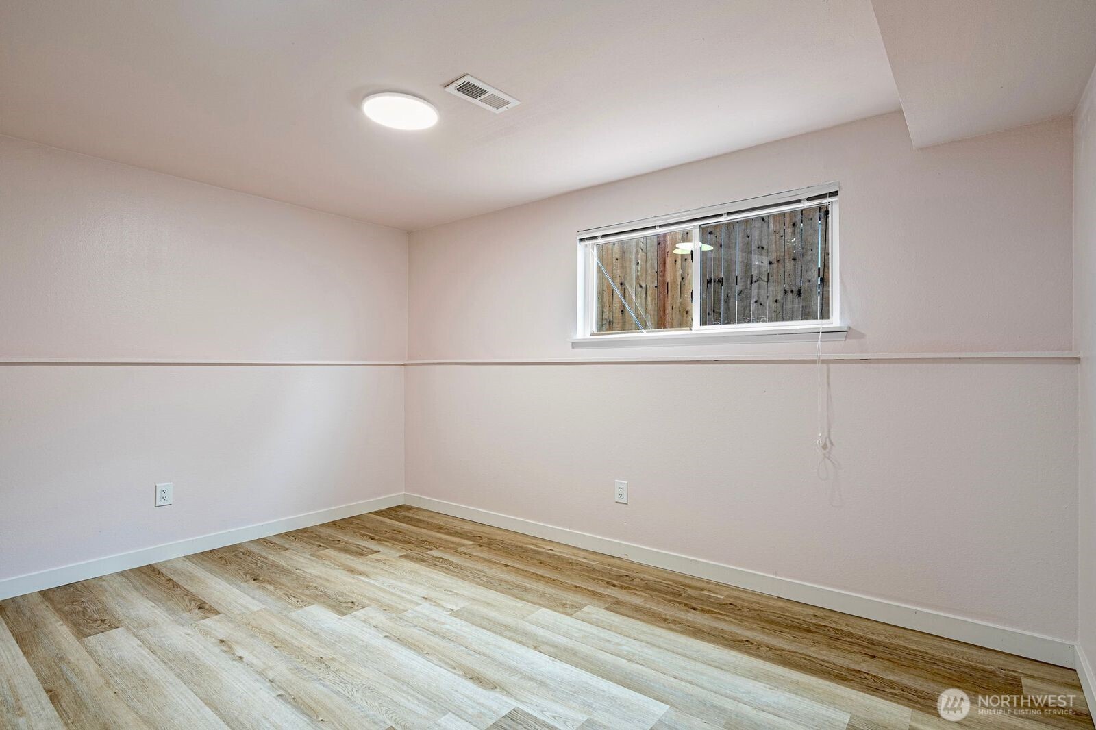 1102 156th Street East Tacoma, WA 98445 - Photo 16 of 20 a view of a room with wooden floor