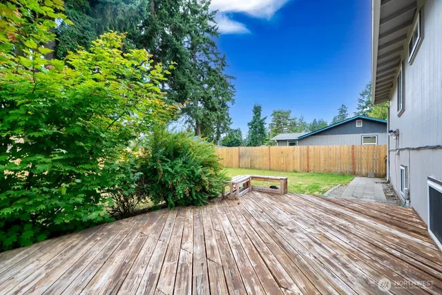a backyard of a house with lots of green space