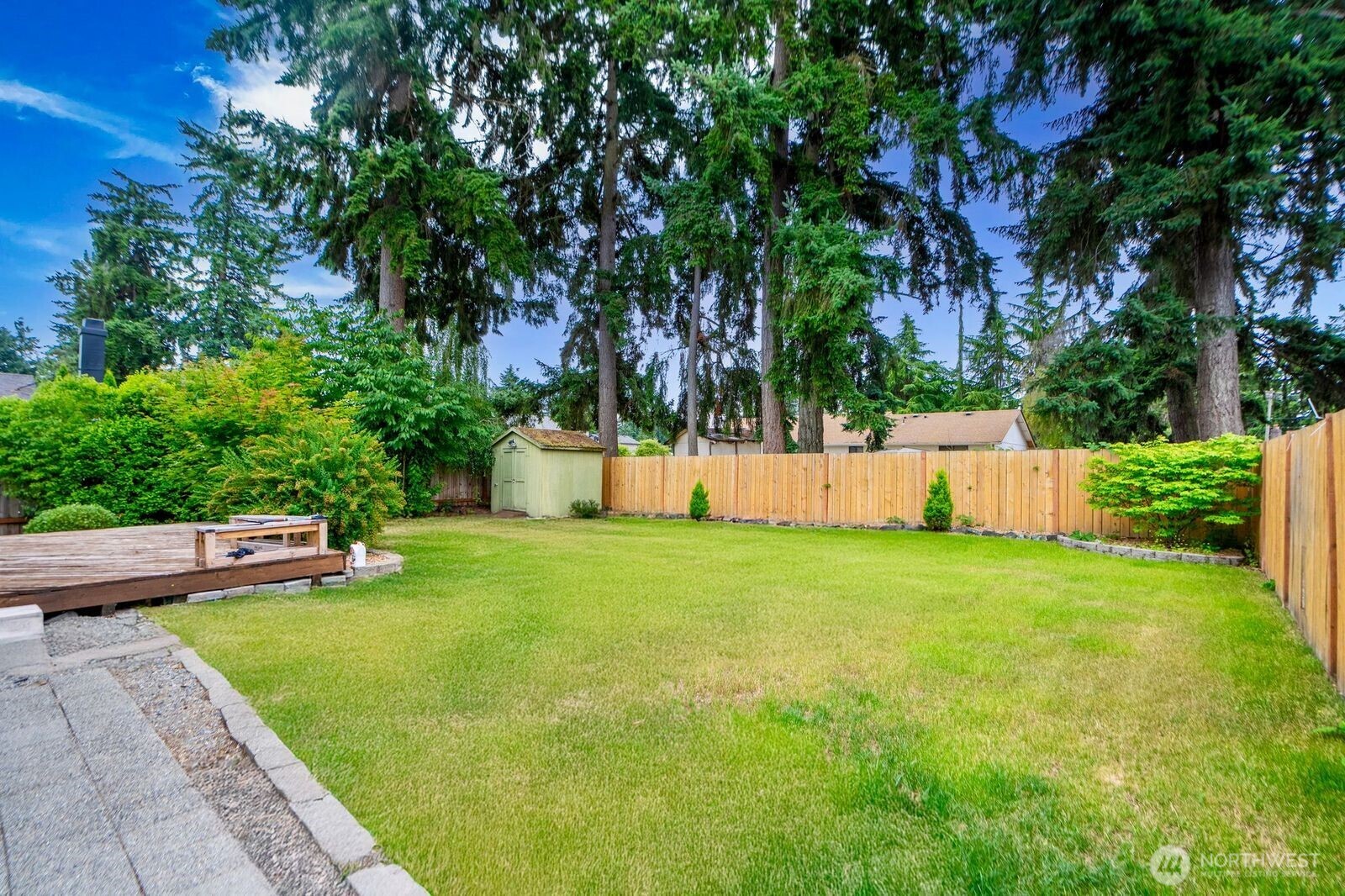 1102 156th Street East Tacoma, WA 98445 - Photo 18 of 20 a view of a backyard with a garden