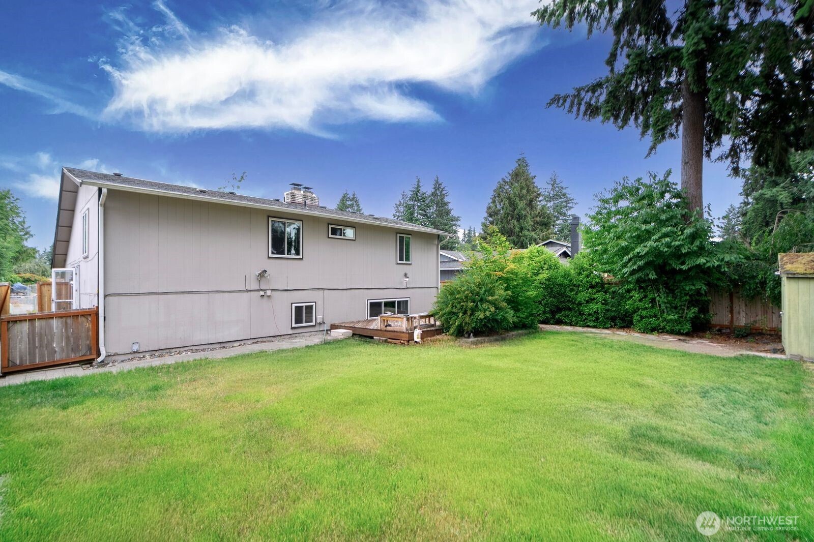 1102 156th Street East Tacoma, WA 98445 - Photo 19 of 20 a view of a backyard with a garden