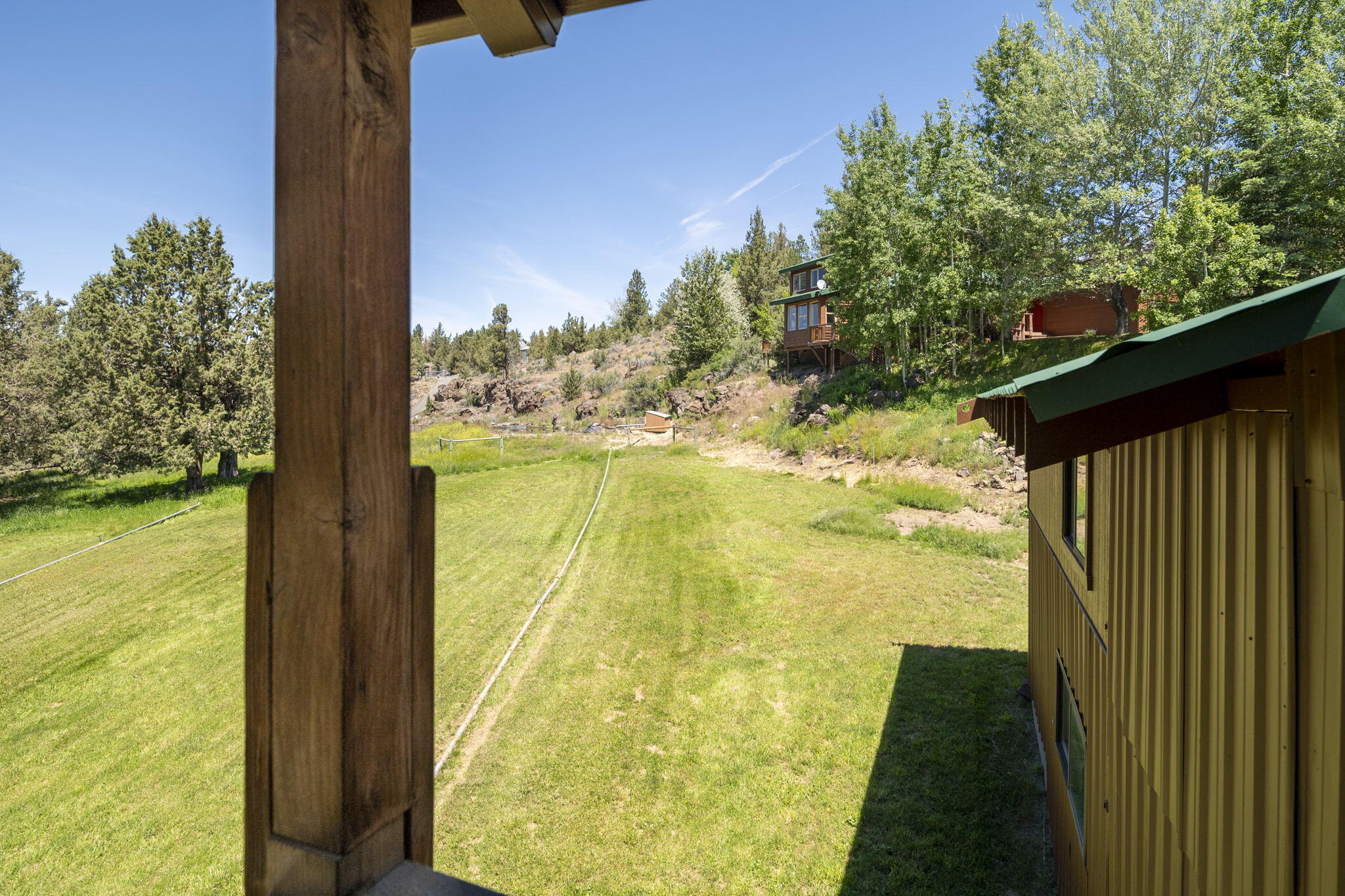 20150 Tumalo Road Bend, OR 97703 - Photo 38 of 53 ADU PORCH VIEW TOWARD HOUSE