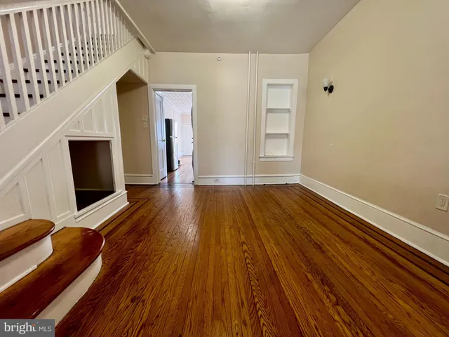 a view of livingroom with hardwood floor and staircase