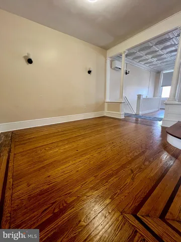 a view of room with wooden floor