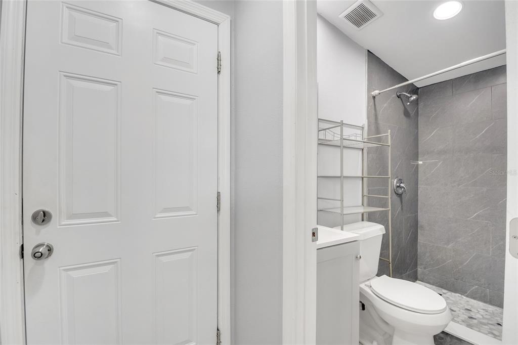 113 Jay Drive Altamonte Springs, FL 32714 - Photo 5 of 14 a bathroom with a toilet a sink and shower