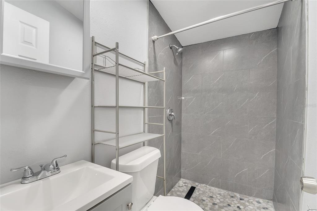 113 Jay Drive Altamonte Springs, FL 32714 - Photo 6 of 14 a bathroom with a sink toilet and shower