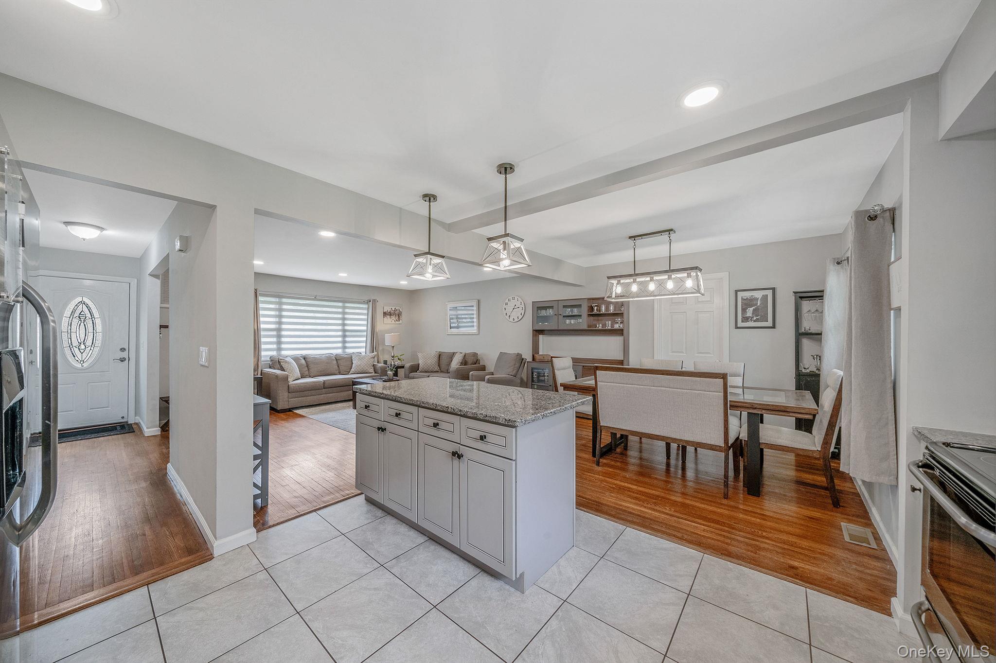 19 Pumpkin Road St. James, NY 11780 - Photo 12 of 35 a kitchen with stainless steel appliances granite countertop a stove and a refrigerator