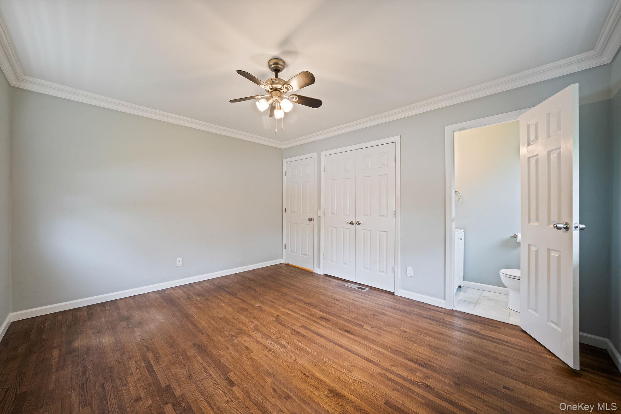 19 Pumpkin Road St. James, NY 11780 - Photo 16 of 35 a view of an empty room and wooden floor