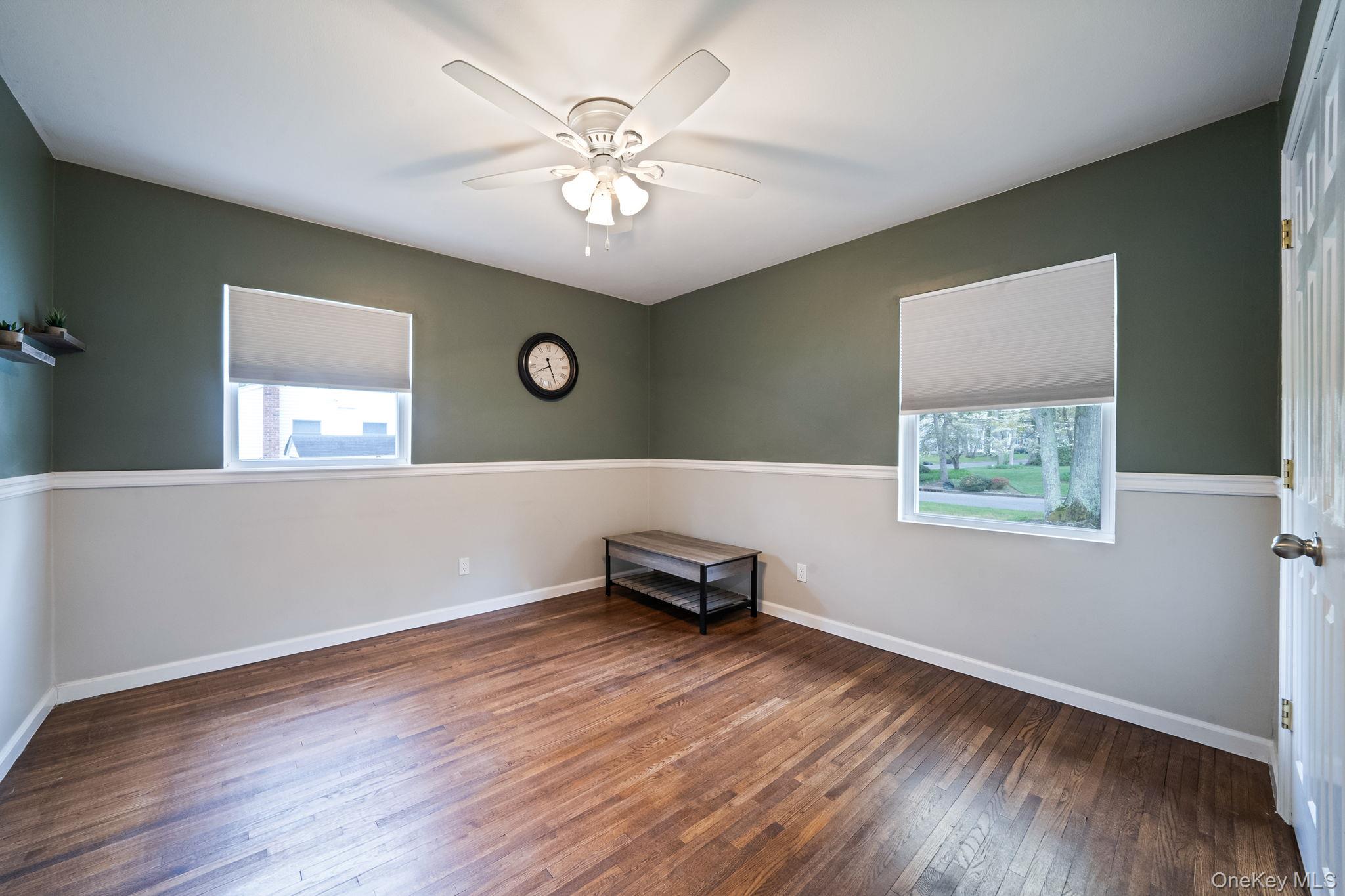 19 Pumpkin Road St. James, NY 11780 - Photo 20 of 35 a view of a livingroom with furniture window and wooden floor