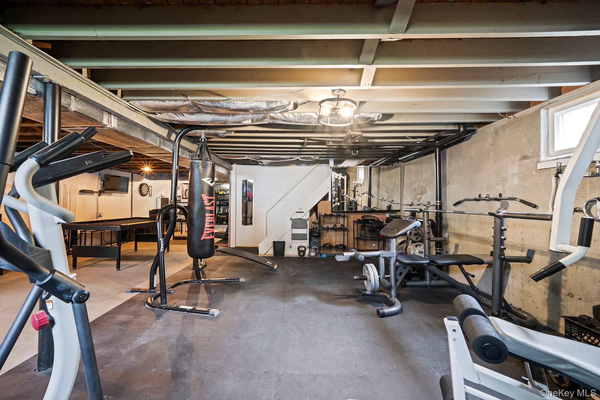 19 Pumpkin Road St. James, NY 11780 - Photo 24 of 35 a view of a room with gym equipment