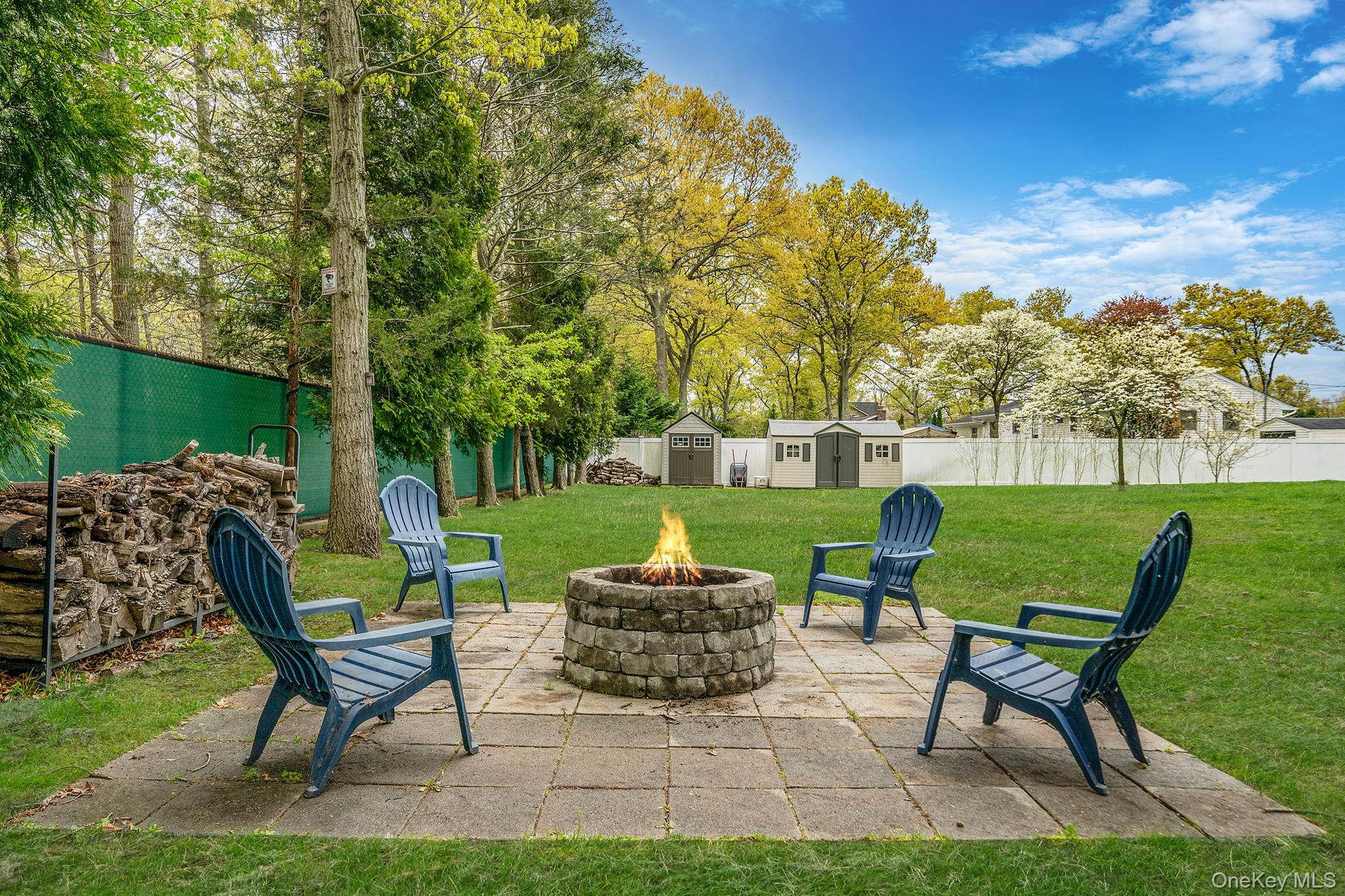 19 Pumpkin Road St. James, NY 11780 - Photo 27 of 35 a view of a chairs and table in the garden
