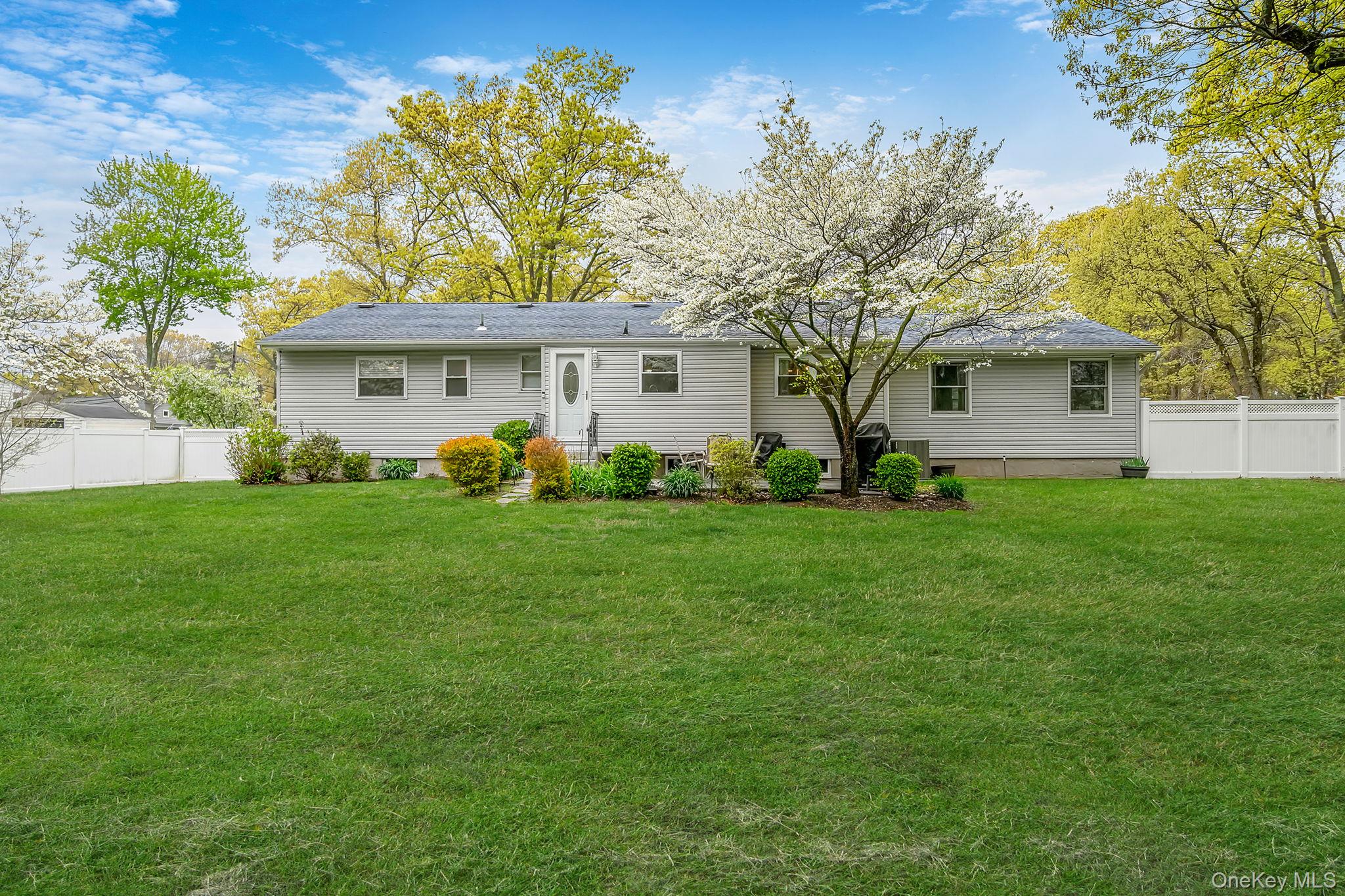 19 Pumpkin Road St. James, NY 11780 - Photo 28 of 35 a front view of house with yard and green space