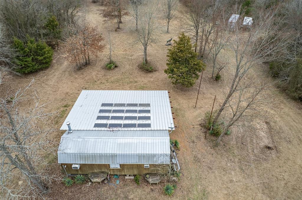 139 Northwest County Road, Unit 1061 Talco, TX 75487 - Photo 9 of 39 a view of a yard