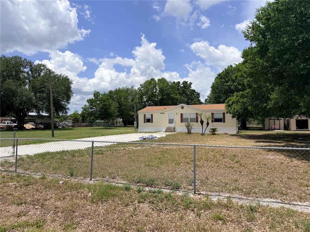 33 Ridge Road Frostproof, FL 33843 - Photo 2 of 21 a view of a house with a yard